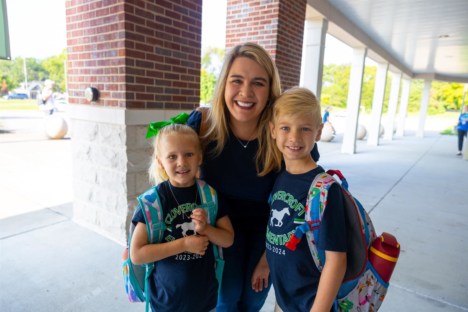 Mother and children on the first day of Kindergarten